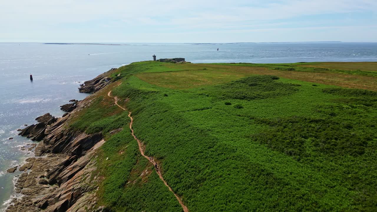 Approaching drone movement to the lighthouse on the beautiful coastal headland of Kermorvan peninsula, Le Conquet, Brittany, France.