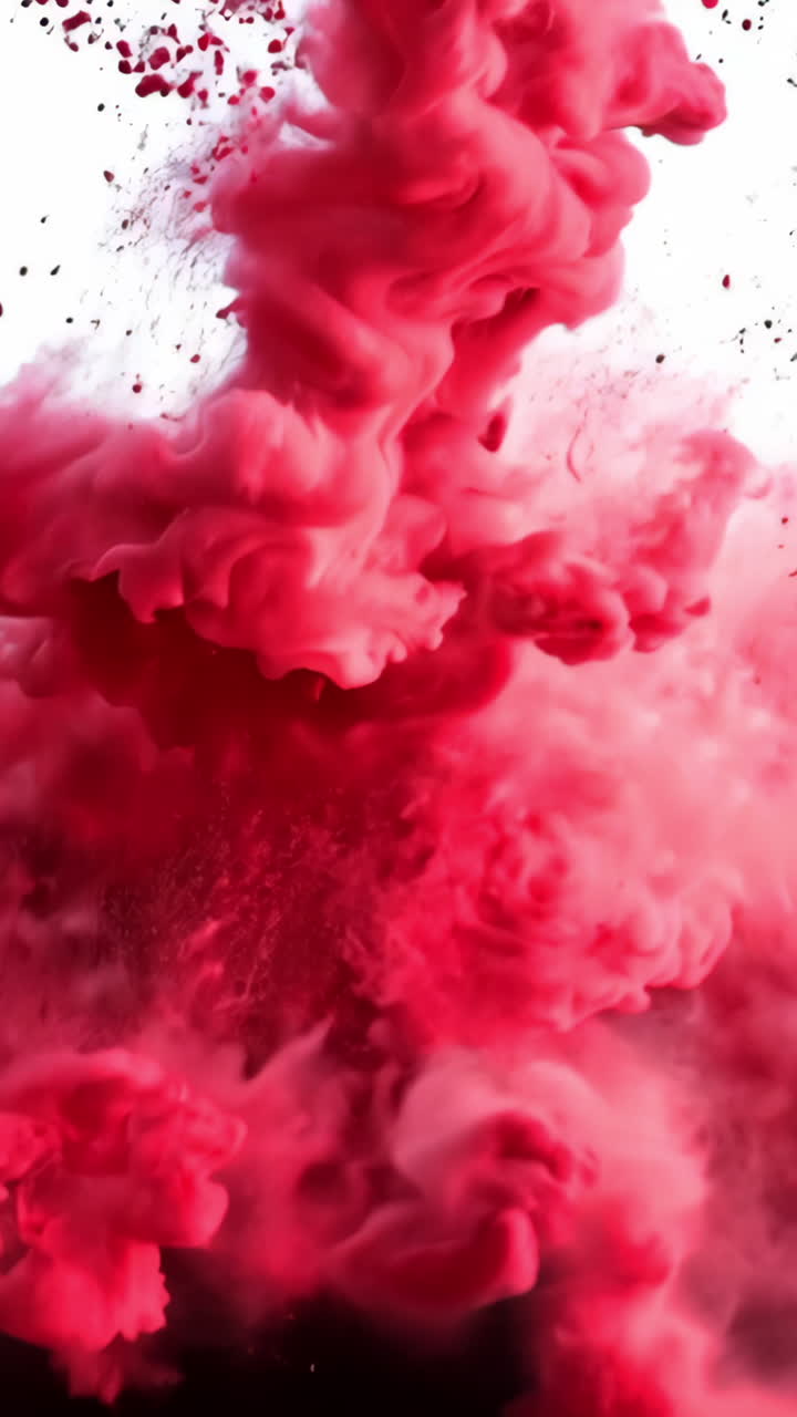 A red cloud of smoke is blowing in the wind. The smoke is red and white, and it looks like it's coming from a fire. Scene is intense and dramatic