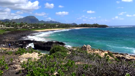 shipwreck beach poipu kauai hawaii wide static 4k with surf, pacific ocean, black lava rock - sand