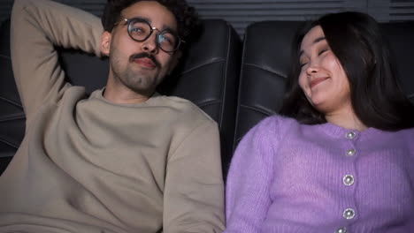 close-up view of a couple sitting in a vip cinema.