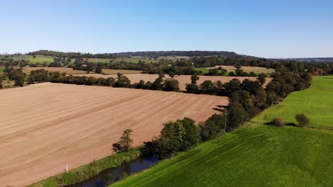 Aerial-Over-Idyllic-Patchwork-East-Devon-Farmland-Countryside-Near-Honiton