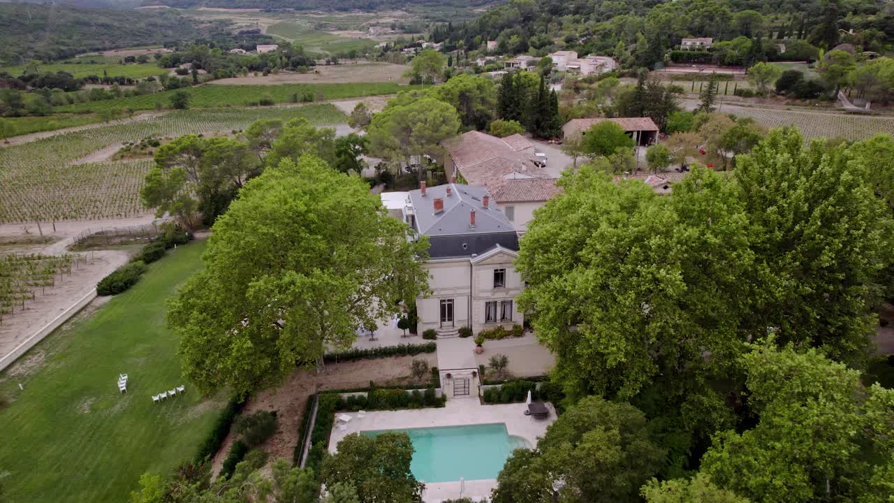 Aerial orbiting shot of a remote villa in Montpellier with surrounding vineyards
