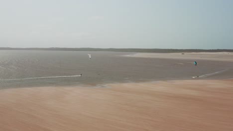 Aerial:-Kitesurfing-in-the-river-delta-of-Parnaiba,-Northern-Brazil