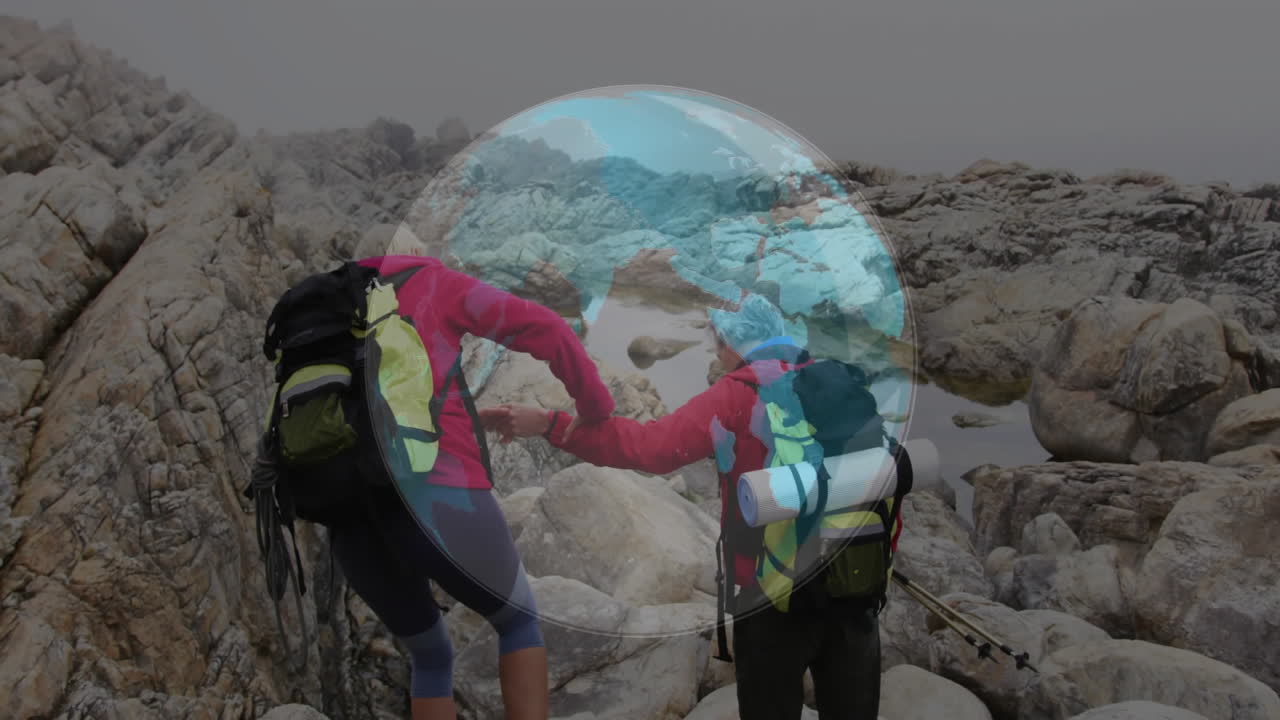 Two hikers climbing rocky coastal shore, with floating route line and technology map icons
