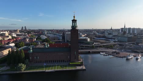 tall city hall in stockholm old town on riverfront