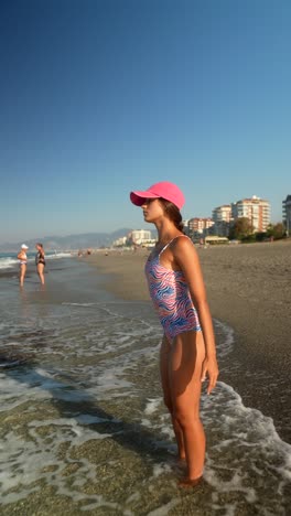 woman on beach in swimsuit