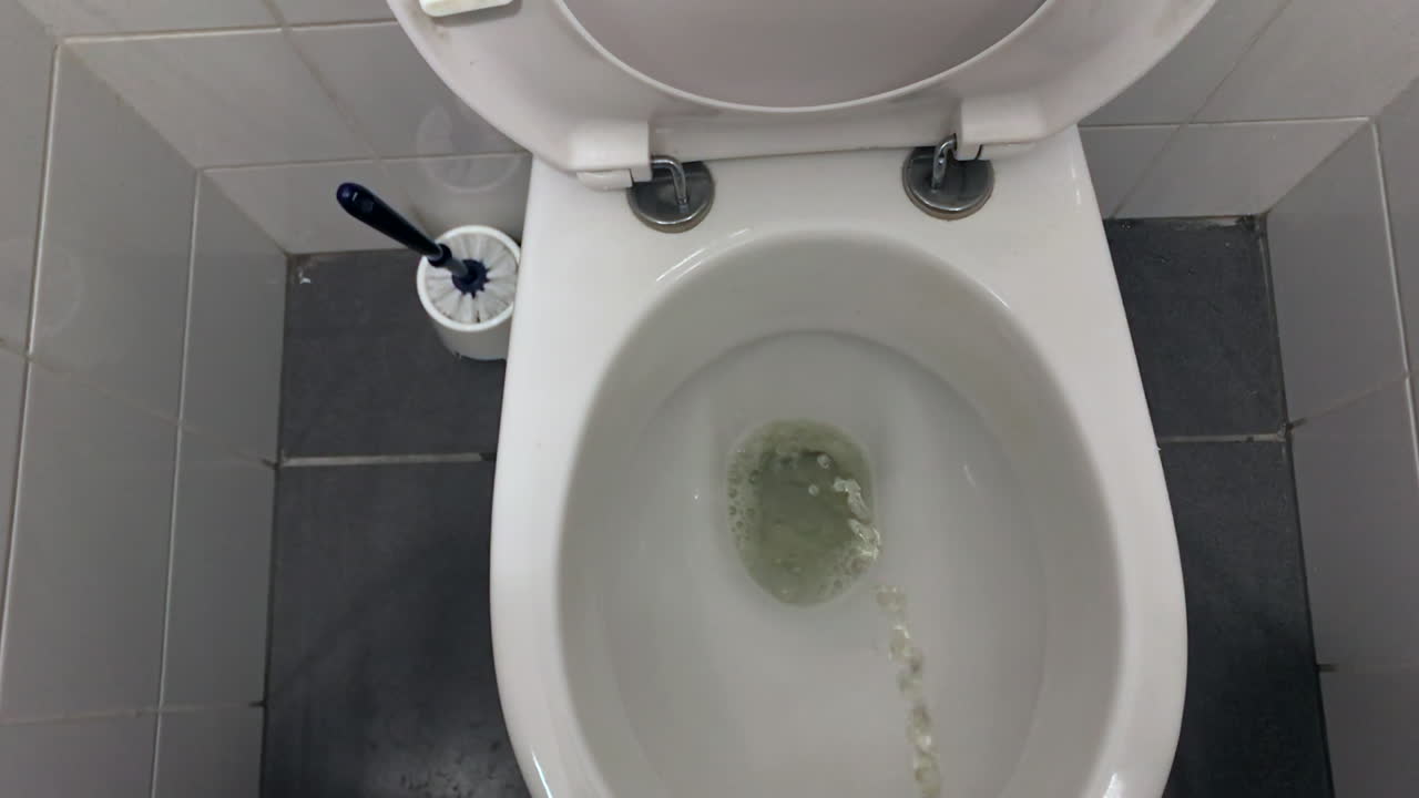 Peeing In A Toilet Bowl From A Standing Point Of View Free Stock Video  Footage Download Clips