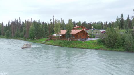 aerial footage a cabin next to the kenai river in alaska