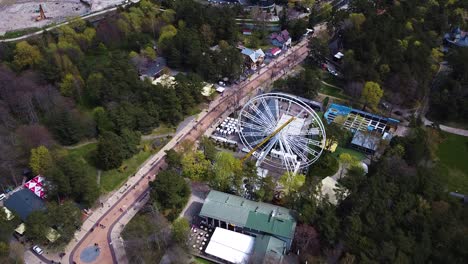 Huge-Ferris-wheel-near-Basanavicius-avenue-in-Palanga,-aerial-view