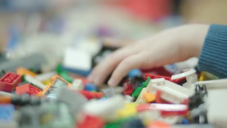 children building with plastic construction blocks