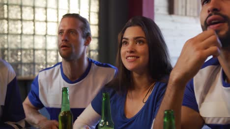 friends at the bar in a pub during the day