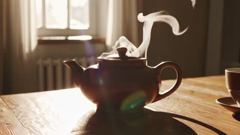steaming teapot in warm morning light