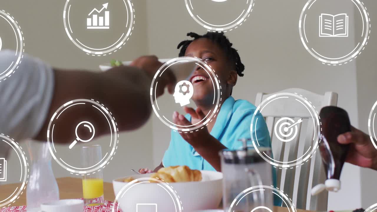 Man passing cereal bowl boy reaching, smiling as education icons appearing and woman pouring syrup