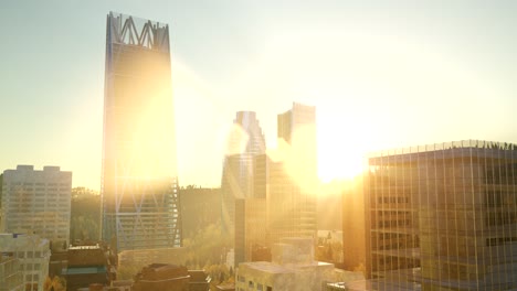 city skyscrapes with lense flairs at sunset