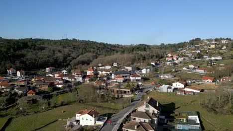 Aerial-drone-footage-of-mountain-village-on-a-sunny-day