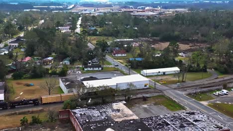 industrial cargo train moving on railway in valdosta, georgia, usa. aerial shot, slow motion