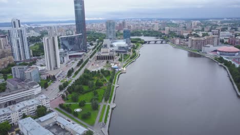 aerial view of a city with river and parks