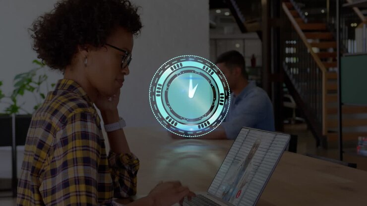 Animation of clock over african american businesswoman having laptop video call with doctor