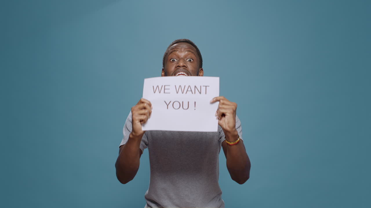 African american worker advertising job offer on paper