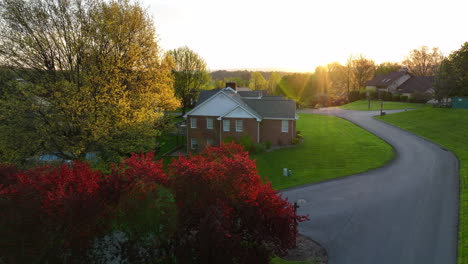 aerial reveal of quiet street at sunrise