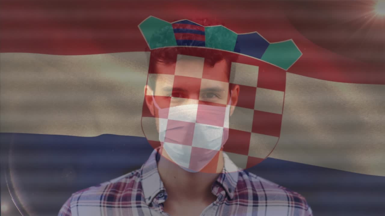 Yüz maskeli Kafkas erkek üzerinde Hırvatistan bayrağının animasyonu.