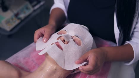 Professional-carboxytherapy-for-young-woman-in-spa-salon.-Close-Up-view-of-professional-cosmetologist-applying-special-mask-on