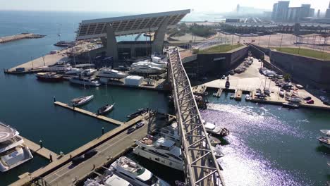 Boat-leaving-the-port-of-Barcelona-with-the-views-of-the-Forum-in-the-background-on-a-sunny-day