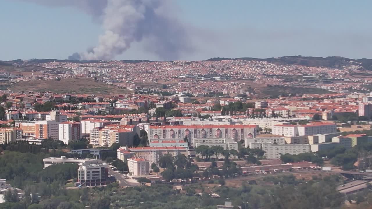 Smoke due to the fire in the City of Lisbon, Portugal. Tilt up drone shot.
