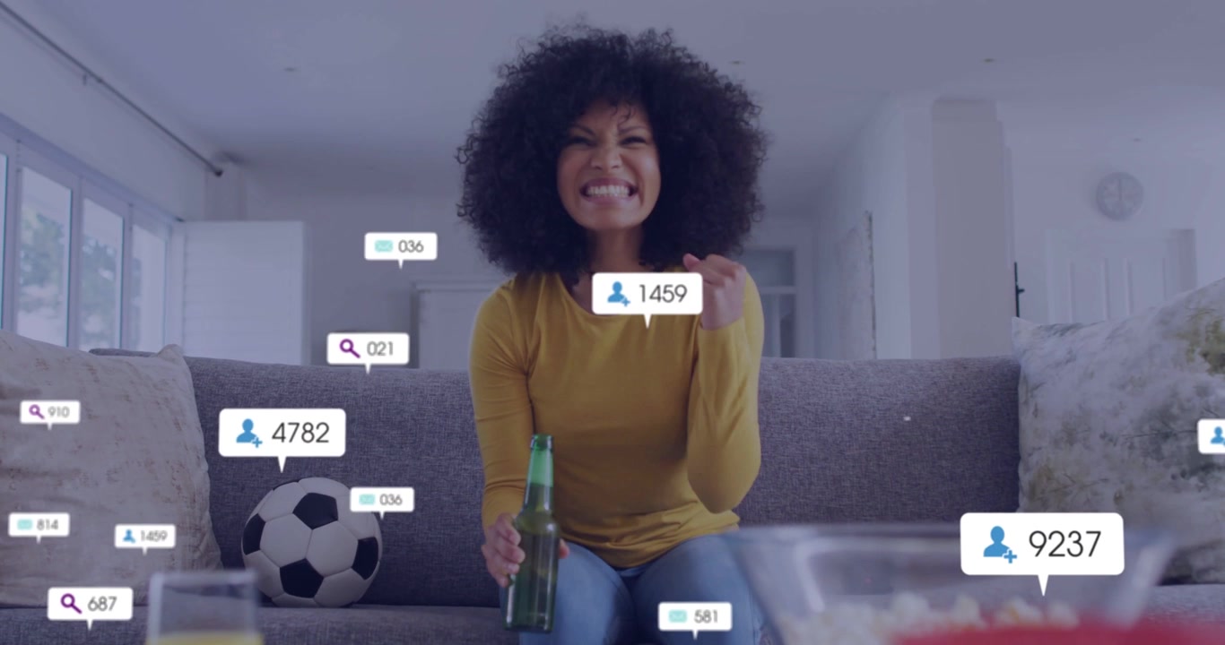 Vertical video: Woman holding bottle watching badges popping up around her, causing cheer for ads