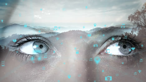 animation of connected icons, cropped eyes of caucasian woman, scenic view of mountains and sky