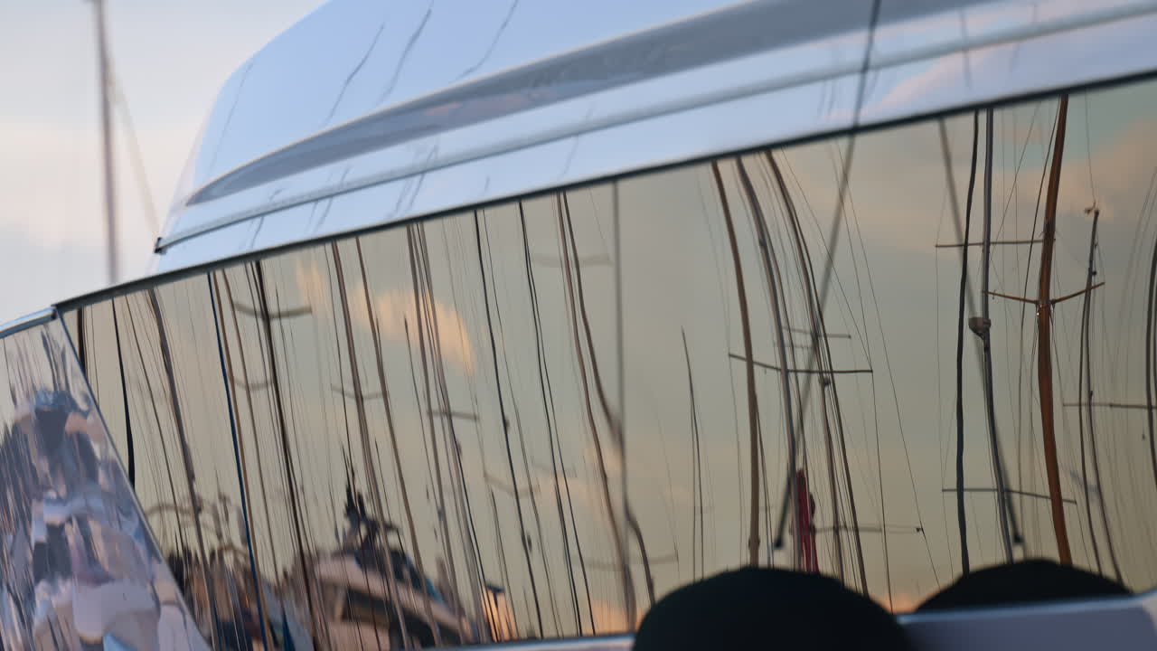 Close up of a white boat docked in the Port of Nice at sunset