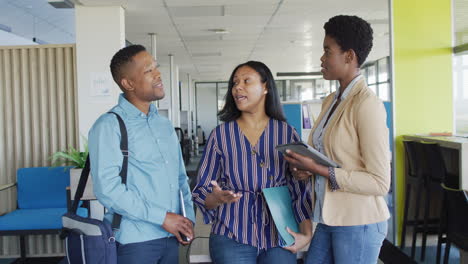 african american business people discussing work at office, slow motion