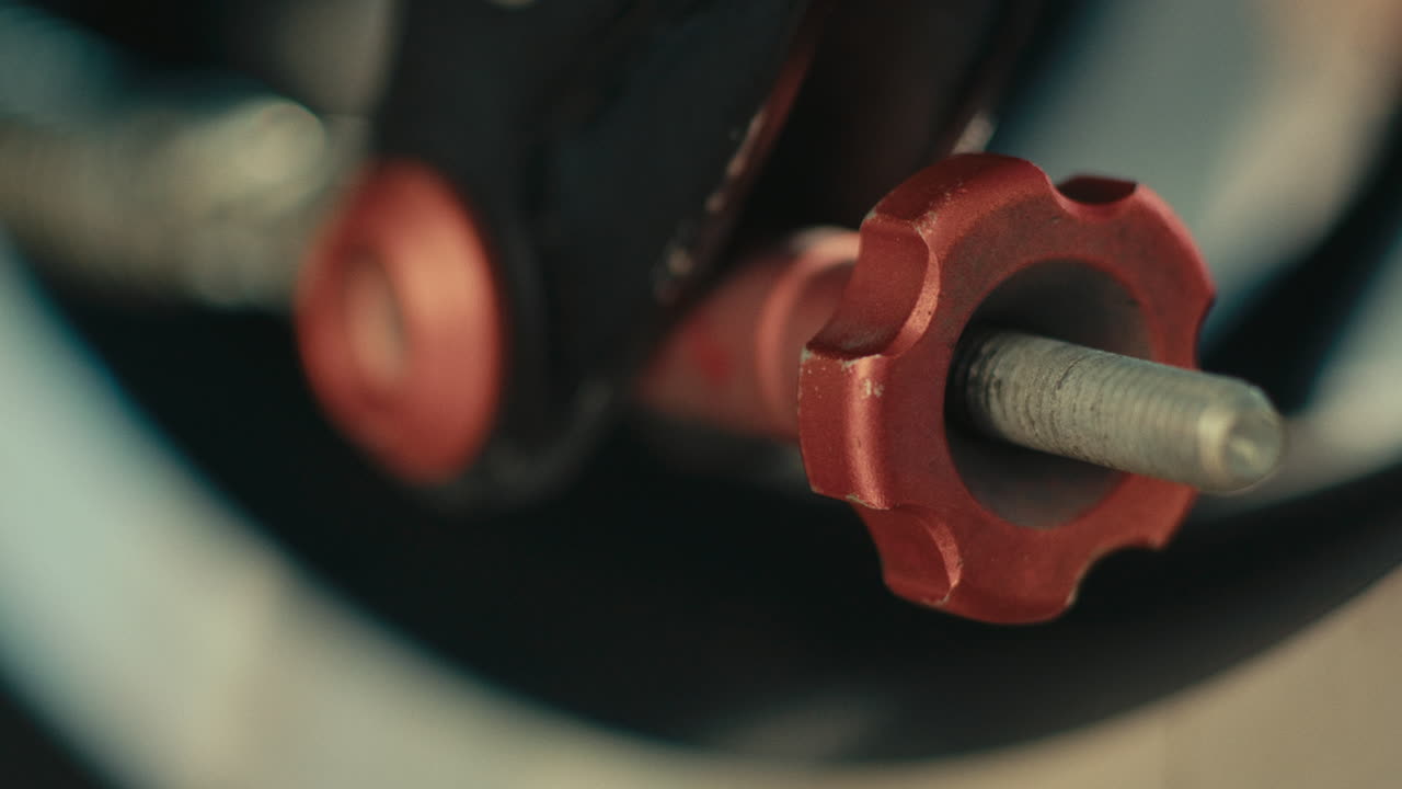 Close-up of a Red Adjustment Bolt