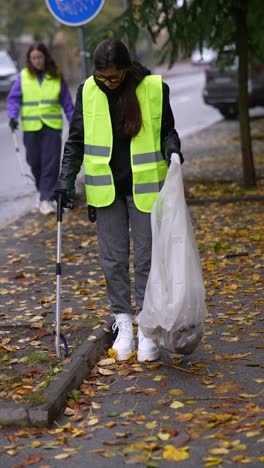 volunteer cleaning up a city street