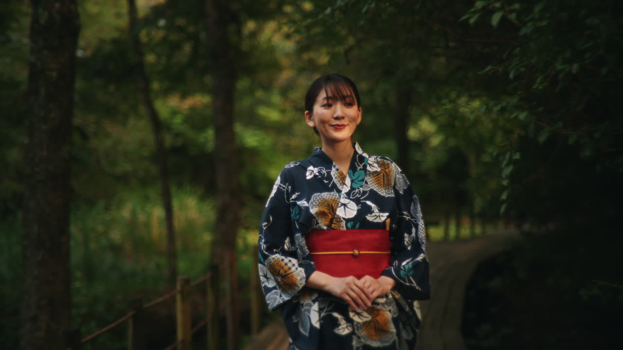 Woman in Yukata on Wooden Path