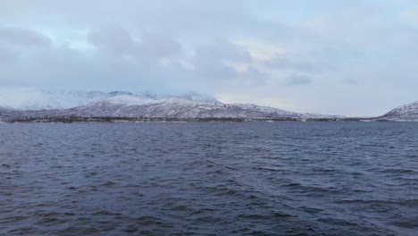 Nordic-Lake-near-Norwegian-boarder-in-Vasterbotten-County,-Sweden---Aerial-crane-down-shot