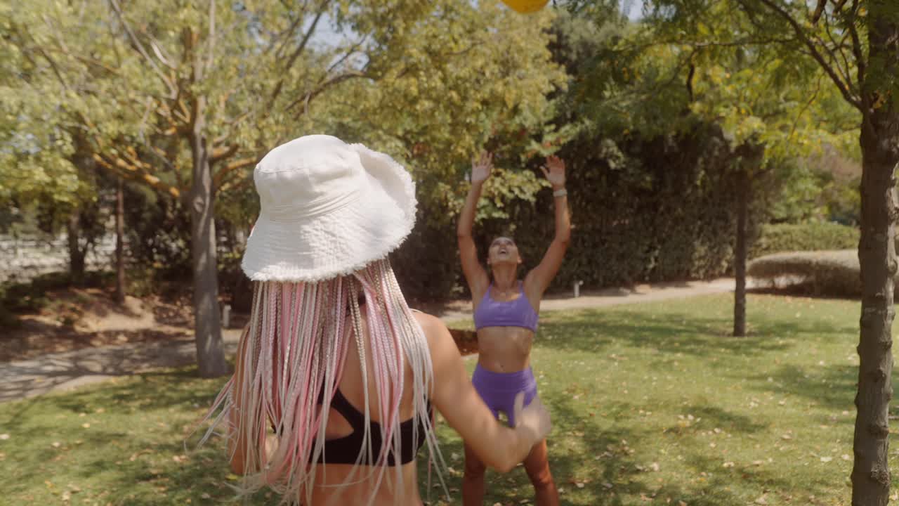 Woman playing with a ball in the park