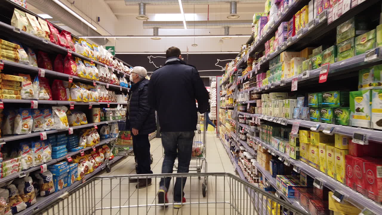 Men shopping with a mask during the Coronavirus lockdown in Italy