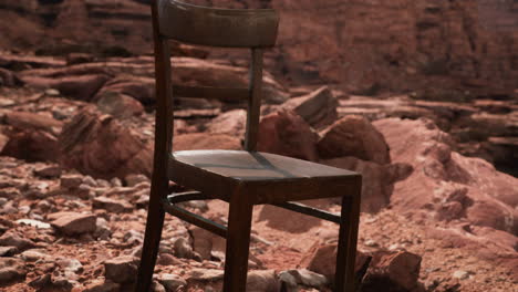 old-wooden-chair-on-rocks-of-Grand-Canyon