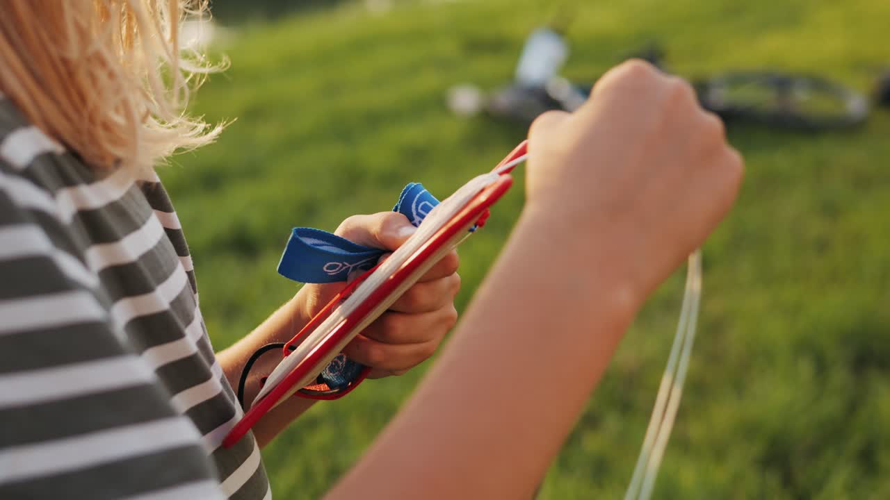 Smiling caucasian child playing with kite on the beach in white clothes. High quality 4k footage