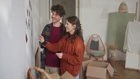 couple moving in and decorating new home
