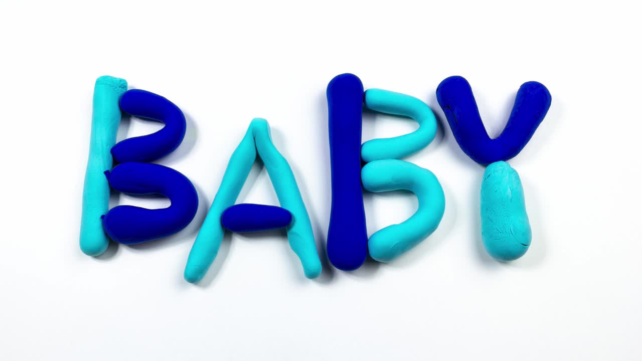 Plasticine stop motion animation creating the pink and blue word BABY.