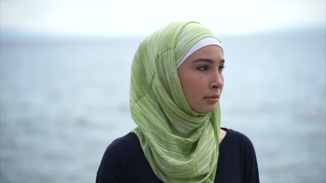 Young Woman in Hijab by the Water