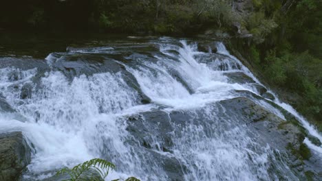 witness the awe-inspiring view from the top of a majestic waterfall, where cascading waters meet the edge of nature's wonder, offering a breathtaking glimpse into the power and beauty of nature