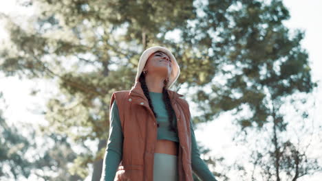 woman enjoying nature with arms outstretched