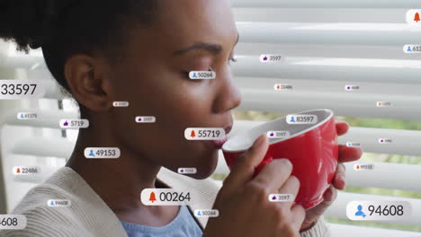 woman sipping red coffee mug near window blinds in marketing scene with floating animated icons