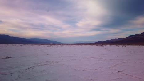 Wide-gimbal-panning-shot-of-the-salt-flats-at-Badwater-Basin-in-Death-Valley,-California