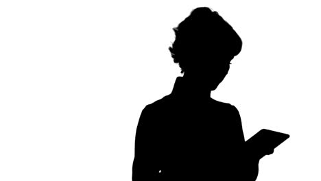 silhouette young woman using a tablet track matte