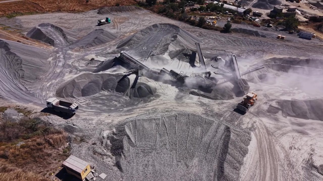 Construction site with heavy machinery and materials in use