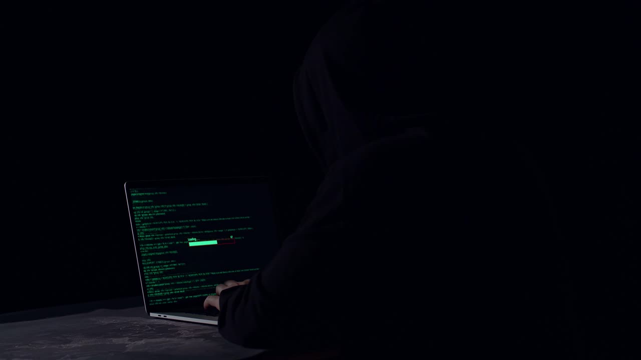 Hacker Using Laptop Computer Hacking And Downloading Data